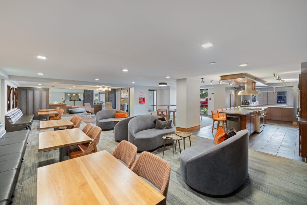 Lobby Social Room, tables and chairs, kitchen