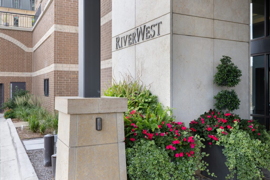 Closeup of plantings in front of RiverWest entrance